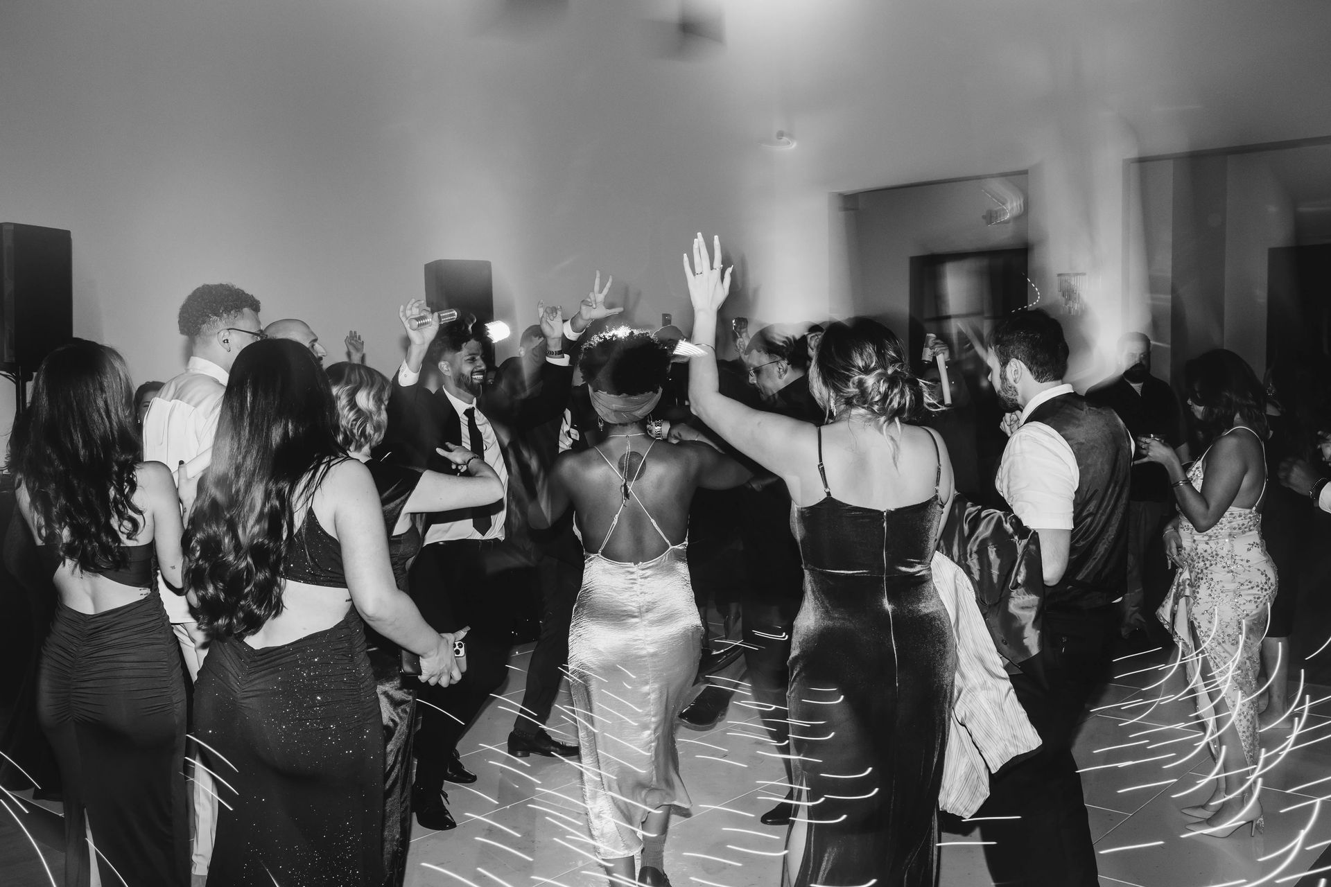 DJ Lakha lighting up a packed wedding dancefloor